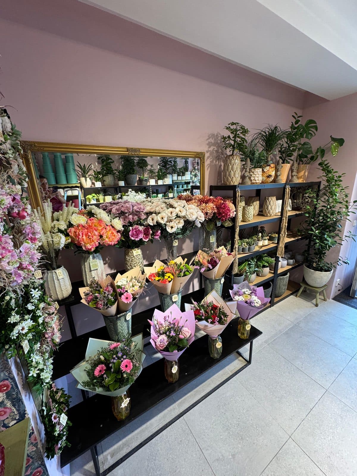 The shop interior with fresh flowers in buckets